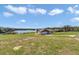 Charming exterior view of the single story home with attached garage and lake view at 16386 Se 156Th Place Rd, Weirsdale, FL 32195