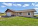 Charming single-story home featuring a well-maintained lawn and attached one-car garage at 16386 Se 156Th Place Rd, Weirsdale, FL 32195