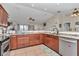Stylish kitchen with stainless steel appliances, granite countertops, and an open layout for easy meal preparation and socializing at 16386 Se 156Th Place Rd, Weirsdale, FL 32195