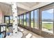 Bright sunroom with wall to wall windows and views of the yard at 16386 Se 156Th Place Rd, Weirsdale, FL 32195