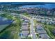 Beautiful aerial view of lakeside neighborhood, showing lush greenery, ponds, and well-maintained homes at 16768 Sanctuary Dr, Winter Garden, FL 34787