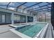 Backyard with a pool, sun shelf, fountains, and screened-in lanai at 16768 Sanctuary Dr, Winter Garden, FL 34787