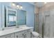 Bathroom with a white vanity, and a tiled walk-in shower at 16768 Sanctuary Dr, Winter Garden, FL 34787