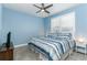 Comfortable bedroom with blue walls, ceiling fan and a window with plantation shutters at 16768 Sanctuary Dr, Winter Garden, FL 34787