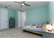 Cozy bedroom with a ceiling fan, carpet flooring, a single bed, and a gray dresser and mirror at 16768 Sanctuary Dr, Winter Garden, FL 34787
