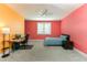 Bright bedroom with modern ceiling fan, desk area, and a comfortable bed near the window at 16768 Sanctuary Dr, Winter Garden, FL 34787