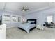 Comfortable main bedroom with a ceiling fan, lots of natural light, and a blue bed at 16768 Sanctuary Dr, Winter Garden, FL 34787