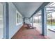 Enjoy the covered patio with brick floors and view of the screened in pool at 16768 Sanctuary Dr, Winter Garden, FL 34787