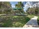 Community playground featuring multiple slides and sunshades for a fun experience at 16768 Sanctuary Dr, Winter Garden, FL 34787