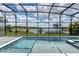 Stunning lake view with a pool and integrated spa and a screened-in lanai at 16768 Sanctuary Dr, Winter Garden, FL 34787