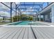 This screened-in pool area includes a hot tub, fountains, and plenty of space for relaxing and entertaining guests at 16768 Sanctuary Dr, Winter Garden, FL 34787