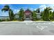 Exterior shot of a community pool area fenced in and featuring a restroom and picnic area at 16768 Sanctuary Dr, Winter Garden, FL 34787