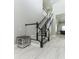 View of the home's staircase with wood and white railing at 16768 Sanctuary Dr, Winter Garden, FL 34787