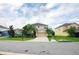 Pleasant home exterior boasting a well-kept lawn, mature trees, and an ample driveway leading to a two-car garage at 1748 Thetford Cir, Orlando, FL 32824