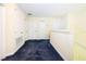 Upstairs hallway with carpeting and multiple doors, offering access to different rooms at 1748 Thetford Cir, Orlando, FL 32824