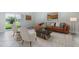 Stylish living room featuring a brown leather couch, accent chairs, and lake view at 1748 Thetford Cir, Orlando, FL 32824