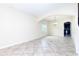 Open-concept living room with tile flooring and an archway to the kitchen at 1748 Thetford Cir, Orlando, FL 32824