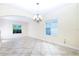 Spacious living room featuring tile flooring, natural light, and neutral paint at 1748 Thetford Cir, Orlando, FL 32824