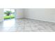 Bright living room with sliding glass doors and views of the lake at 1748 Thetford Cir, Orlando, FL 32824