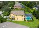Aerial view showing screened pool and backyard, located in a well maintained community at 17614 Woodcrest Way, Clermont, FL 34714