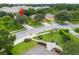 Aerial neighborhood view showcases manicured lawns and easy access to community green space at 17614 Woodcrest Way, Clermont, FL 34714