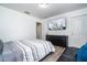 Spacious bedroom features modern decor, a comfortable bed, and a large television at 17614 Woodcrest Way, Clermont, FL 34714