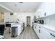 Updated kitchen boasts a large island, stainless steel appliances, and an abundance of storage space at 17614 Woodcrest Way, Clermont, FL 34714