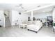 Welcoming living area featuring an open floor plan, sleek floors, and abundant natural light at 17614 Woodcrest Way, Clermont, FL 34714