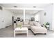 Bright living room with a comfortable couch, hardwood floors, and an open floor plan at 17614 Woodcrest Way, Clermont, FL 34714