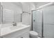 Bathroom featuring a glass-enclosed shower with subway tiles and a vanity with quartz countertop at 18309 Oliver Twist Way, Winter Garden, FL 34787