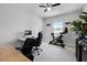 Bright bedroom with desk, workout bike, and a view from the window at 18309 Oliver Twist Way, Winter Garden, FL 34787