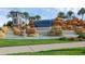 Beautiful Waterleigh community entrance featuring a tiered rock fountain and lush landscaping at 18309 Oliver Twist Way, Winter Garden, FL 34787
