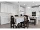 Eat in kitchen offers sleek cabinetry and a large island with breakfast bar seating at 18309 Oliver Twist Way, Winter Garden, FL 34787