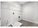 Empty laundry room showcasing tile floor and shelving at 18309 Oliver Twist Way, Winter Garden, FL 34787
