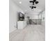 Upstairs living room with carpet, railing, and TV at 18309 Oliver Twist Way, Winter Garden, FL 34787