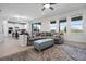 Spacious living room open to kitchen, featuring hardwood floors, and access to backyard at 18309 Oliver Twist Way, Winter Garden, FL 34787