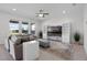 Inviting living room showcasing hardwood floors, ceiling fan, and an entertainment center at 18309 Oliver Twist Way, Winter Garden, FL 34787