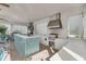 Upscale outdoor kitchen with stainless steel grill and a tiled bar with countertop seating at 18309 Oliver Twist Way, Winter Garden, FL 34787