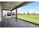 Paver patio featuring a covered area, a view of the lawn and partial view of the screened in porch at 18309 Oliver Twist Way, Winter Garden, FL 34787