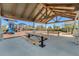Community picnic area under a pavilion, with playground in the background and picnic tables for residents to enjoy at 18309 Oliver Twist Way, Winter Garden, FL 34787