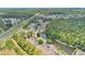 Extensive aerial view of community showcasing pond, recreation facilities, and abundant green spaces at 2020 Royal Bay Blvd # 91, Kissimmee, FL 34746