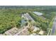 Scenic aerial view of townhome community featuring a pool, lake, and surrounding green landscape at 2020 Royal Bay Blvd # 91, Kissimmee, FL 34746