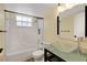 Bathroom featuring a glass bowl sink and a bathtub with tile surround at 2020 Royal Bay Blvd # 91, Kissimmee, FL 34746