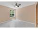 Spacious bedroom with modern ceiling fan and light, featuring a large bright window at 2020 Royal Bay Blvd # 91, Kissimmee, FL 34746
