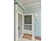 Inviting entrance with a charming doormat, a secure digital lock, and a well-lit porch creating a warm welcome at 2020 Royal Bay Blvd # 91, Kissimmee, FL 34746