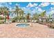 Inviting hot tub surrounded by brick paving and mature landscaping, perfect for unwinding at 2020 Royal Bay Blvd # 91, Kissimmee, FL 34746