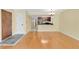 Bright living room with hardwood floors opens to a kitchen featuring stainless steel appliances at 2020 Royal Bay Blvd # 91, Kissimmee, FL 34746