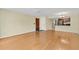 Spacious living room with hardwood floors, neutral walls, and an open layout connecting to other living areas at 2020 Royal Bay Blvd # 91, Kissimmee, FL 34746