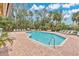Beautiful outdoor pool with lounge chairs and lush landscaping, ideal for relaxation at 2020 Royal Bay Blvd # 91, Kissimmee, FL 34746
