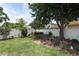 Serene backyard featuring a charming garden area with chairs, perfect for enjoying nature at 2021 Wildfire Ct, Apopka, FL 32703